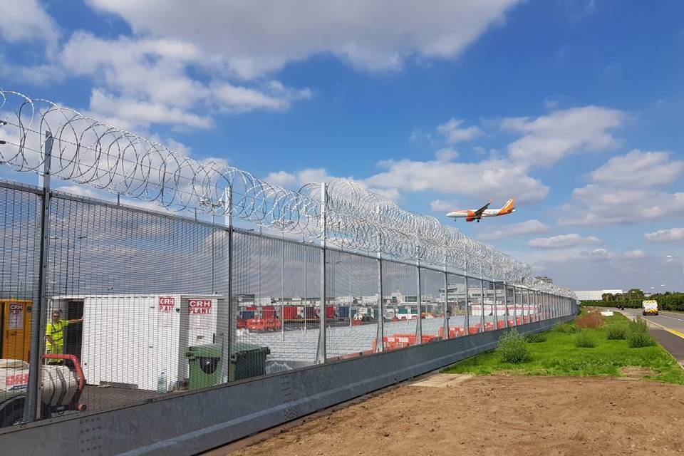 Black 358 high security fence with razor wire are installed in the airport