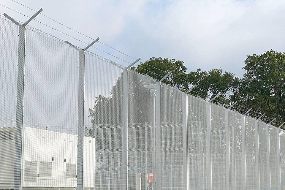 358 security fence is equipped with a barbed wire topping and installed along the prison area.